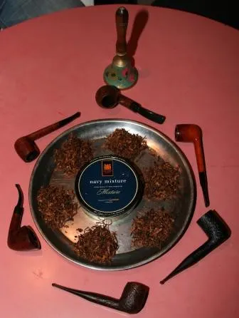 Photo of the bell, the competitors' pipes, and the tobacco used