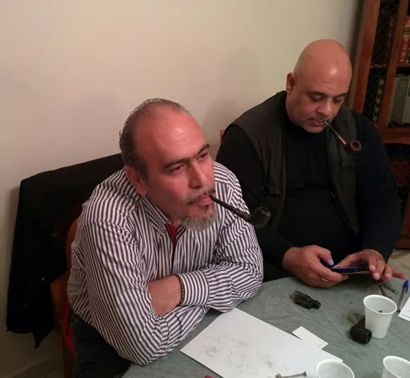 Peter concentrating on his smoke, with Tarek acting as time-keeper and referee