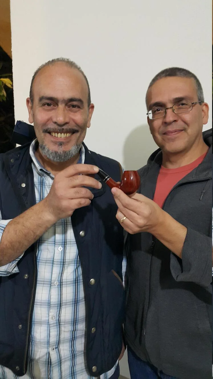 Peter getting his prize, a Vauen pipe, from Paul